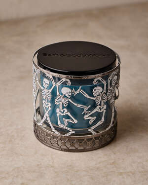 Glow-in-the-Dark Dancing Skeleton 3-Wick Candle Holder