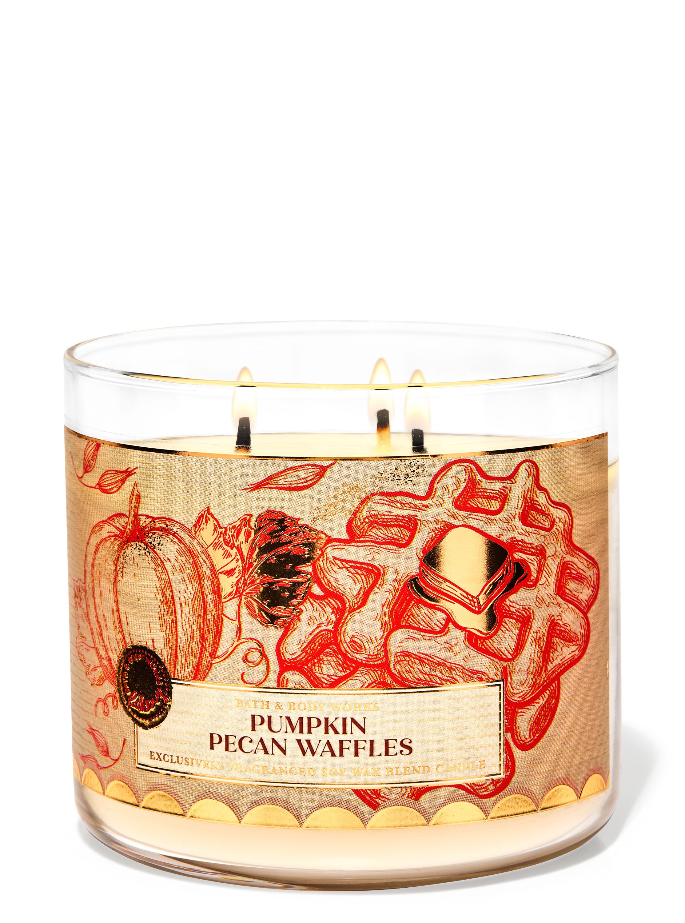 A glass jar 3-wick candle with a brown label on it