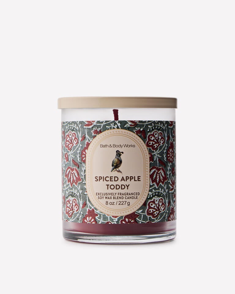 A red candle in a glass jar